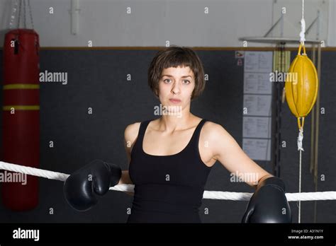 Female Boxer Leaning On Ropes Of Boxing Ring Stock Photo Alamy