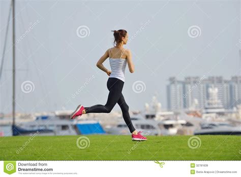 Young Beautiful Woman Jogging On Morning Stock Image