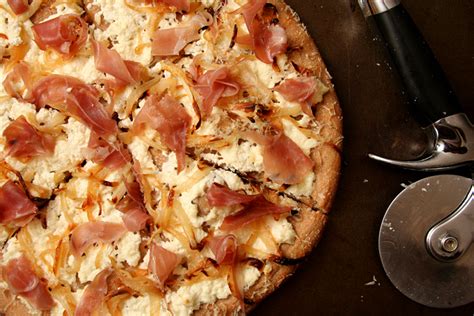 Pizza With Ricotta Caramelized Onions And Prosciutto