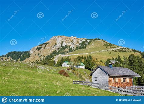 Mountain Landscape With Forest Lake And Blue Sky In