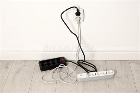 Extension Cords With Power Plugs In Socket Indoors Stock Photo Image