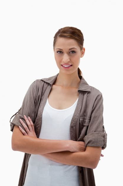 Premium Photo Smiling Woman Standing With Folded Arms