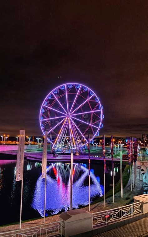 Reflection In Water Of The Ferris Wheel At Night Stock Photo Image Of