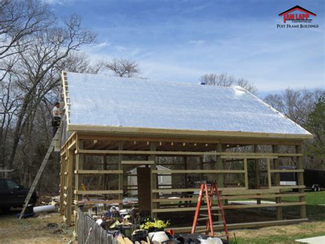 To complete the air seal in the pole barn, we suggest spraying open cell spray foam insulation on the roof deck. Pole Building Insulation - Tam Lapp Construction, LLC