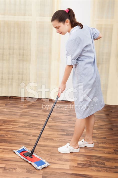 Young Maid Cleaning Floor Stock Photo Royalty Free Freeimages