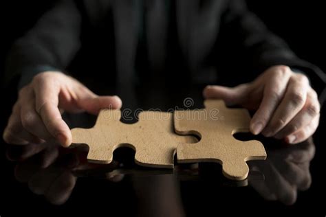 Man Holding Two Pieces Of A Puzzle With Strategy Stock Image Image Of