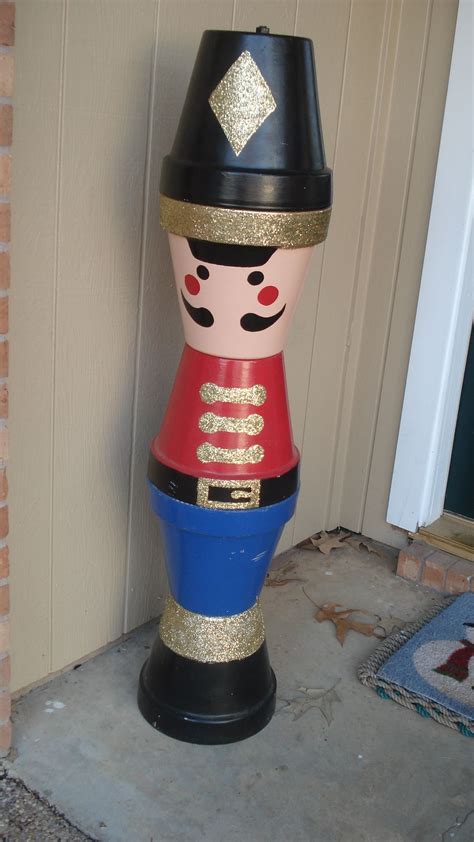 Create Your Own Clay Pot Christmas Soldier By Stacking Clay Pots On Top