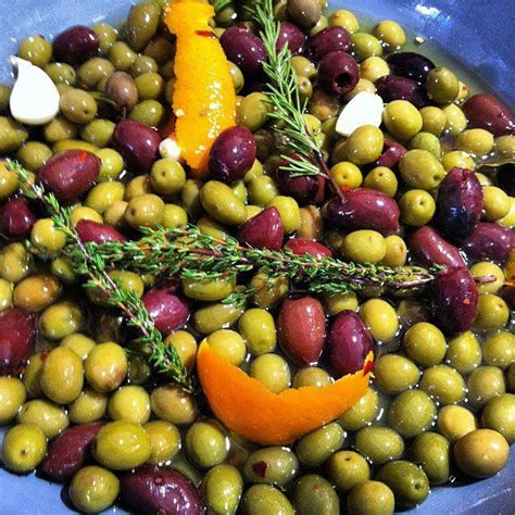 Marinate Olives By Simmering With Lemon And Orange Peels Whole Garlic