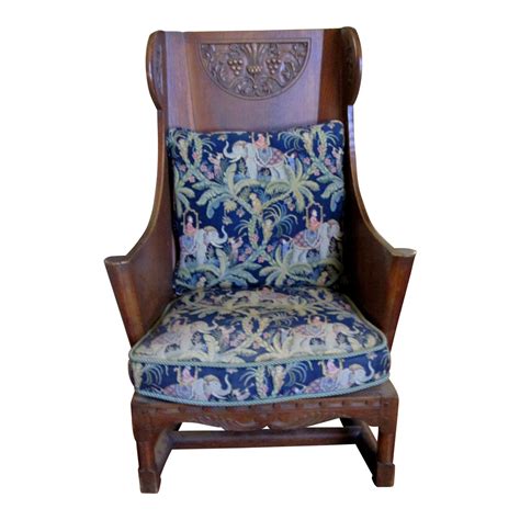 5 out of 5 stars. Antique Ornate Carved Wooden Wingback Chair W/ Monkey & Elephant Upholstered Cushions | Chairish