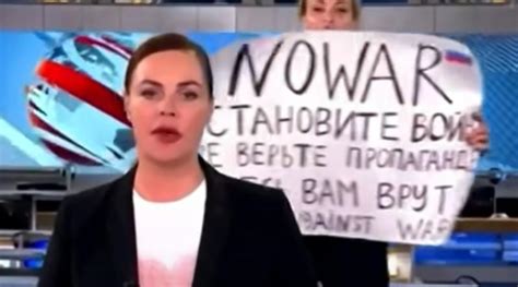 watch woman interrupts russian tv news broadcast tells nation not to believe propaganda