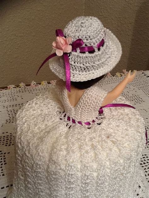Make sure that the band is hidden within the crochet stitches. Beautiful Handmade Crochet Doll Toilet Paper Cover