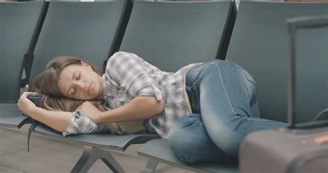 Tired Woman Resting In Airport Waiting Area Stock Footage Sbv