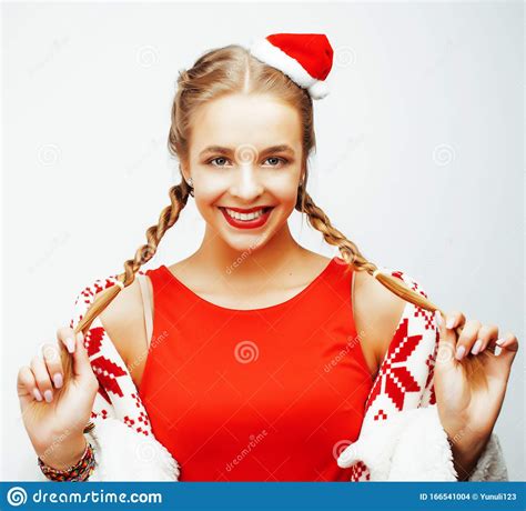 Young Pretty Happy Smiling Blond Woman On Christmas In Santas Red Hat