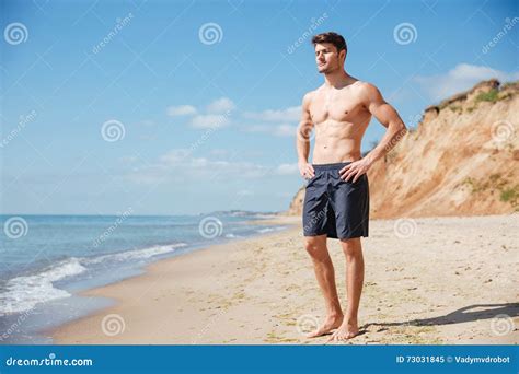 Relaxed Young Man Standing On The Beach Stock Image Image Of Bright