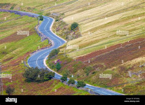 Winding road running through countryside in Cumbria, England Stock ...