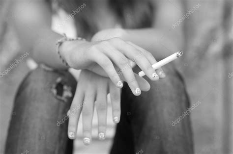 Teenage Female Hand Holding Cigarette Stock Photo By ©solidphotos 82091512