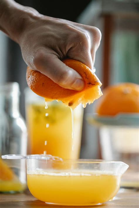 Crop Person Preparing Fresh Orange Juice · Free Stock Photo