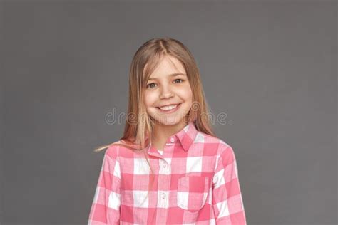 Freestyle Girl Standing Isolated On Grey With Book Pointing Up Idea