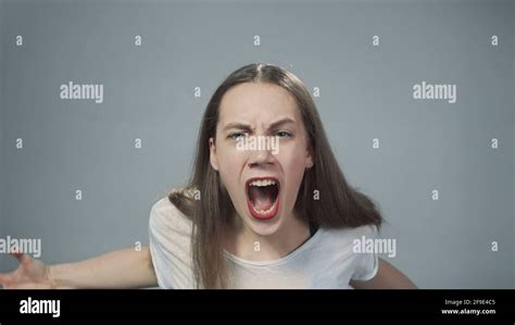Photo Of Young Yelling Girl On Grey Stock Photo Alamy