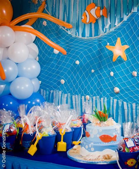 An Under The Sea Themed Birthday Party With Balloons Cake And Other