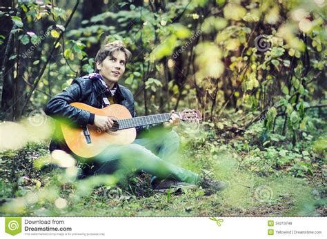 Don't know what to play? Young Man Playing Guitar Royalty Free Stock Photos - Image ...