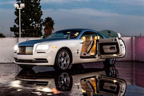 Our customers are overwhelmingly satisfied when they choose one of our rolls royce models. rolls royce wraith rental suicide door open white wedding ...