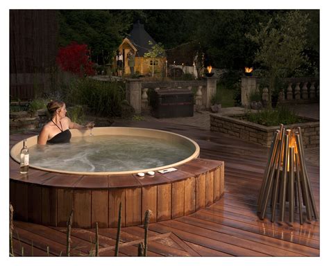 A 7 Round Cedar Hot Tub Integrated Into A Beautiful Back Yard Find Out More At