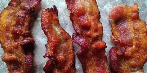 Flip the bacon strips once half way through for added crispiness. How To Bake Bacon - Cook Bacon In The Oven