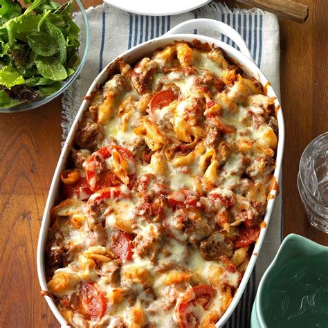 In a large bowl, mix together the mushrooms, spaghetti sauce, shredded mozzarella cheese, pasta, and browned ground beef and onion mixture. Italian Pasta Bake Recipe | Taste of Home