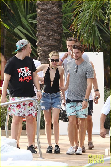 miley cyrus and patrick schwarzenegger get flirty poolside in miami with cody simpson photo