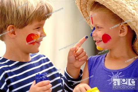 Portrait Close Up Boy And Girl Wearing Strawhat Both 6 Years Old