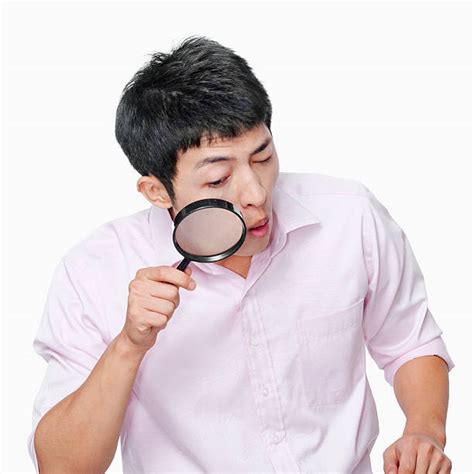 Royalty Free Young Man Looks Through A Magnifying Glass Pictures