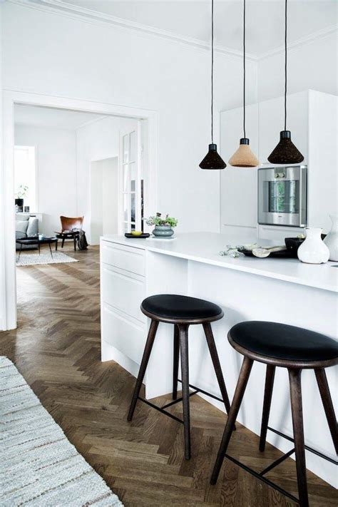 Whenever your kitchen is functional it's time to consider decor. White Scandinavian kitchen - with modern black accents and ...