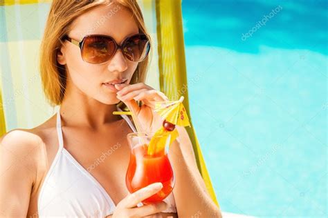 Woman In White Bikini Drinking Cocktail Stock Photo By Gstockstudio