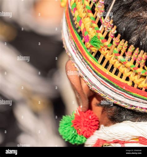 abstract portrait of a naga tribesman dressed in his tribal attire wearing a colorful