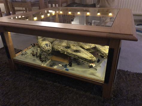 My Star Wars Millennium Falcon Deagostini model in a ... A client asked if we knew of a custom themed coffee table based on han solo's beloved millennium falcon for sale, and we decided to make something with just a little time and skill, we turned the toy and mass produced model into ships that looked like movie props for our star wars coffee table.
