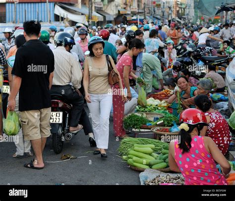 Many People Crowd On The Road At A Street Market Vinh Longh Mekong