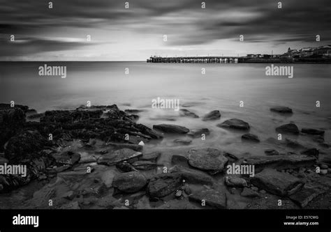 Long Exposure Seascape Landscape During Dramatic Evening Sunset In