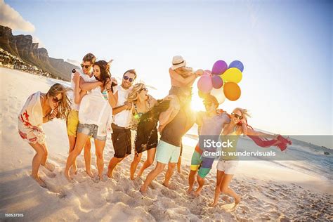 Young Party People Having Fun At The Beach Stock Photo Download Image