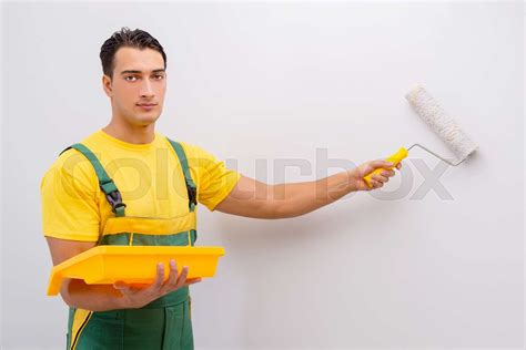 Man Painting The Wall In Diy Concept Stock Image Colourbox