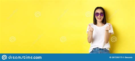 Fashion And Lifestyle Concept Attractive Asian Woman In Heart Shape Sunglasses Showing Finger