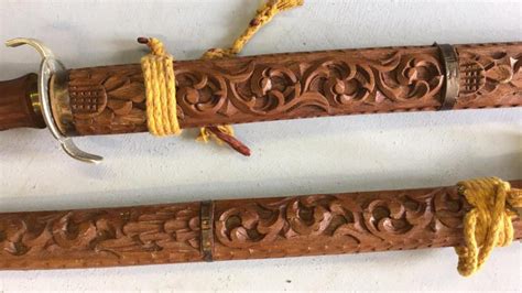 Sold Price Pair Of Oriental Swords With Carved Wooden Sheaths July 6