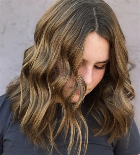 21 middle part hairstyles that will flatter anyone hairstyles vip