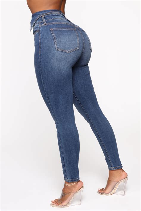 flip flop exposed button skinny jeans medium blue wash fashion nova