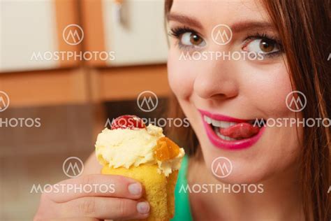 Woman Eating Cake Licking H By Voy Mostphotos