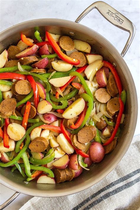 .italian sausages, red bell pepper, green bell pepper, yellow bell pepper, white onion, garlic, diced tomato, oregano, salt, black ground pepper. Vegan Sausage with Peppers & Potatoes - The Simple Veganista