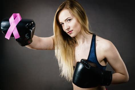 Young Woman Wearing Boxing Gloves Having Pink Ribbon Stock Image