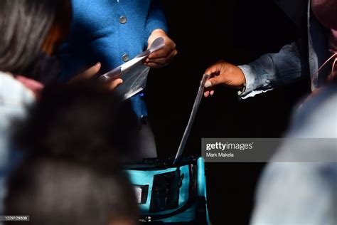 A Voter Casts Her Early Voting Ballot At The A B Day School Polling