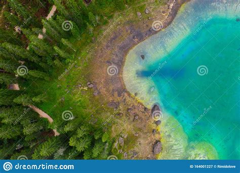 Aerial View Of Turquoise Blue Water Of Lake Carezza In Alps Dolomites