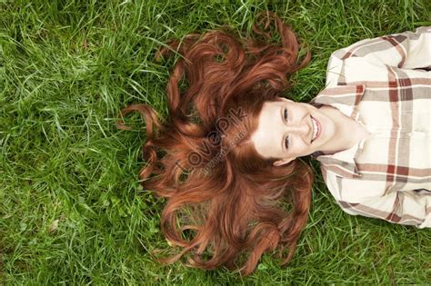 photo of a teenage girl lying in the grass picture and hd photos free download on lovepik